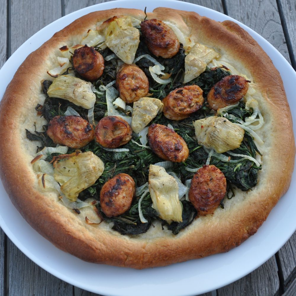 pizza with white wine crust, italian sausage and artichoke hearts