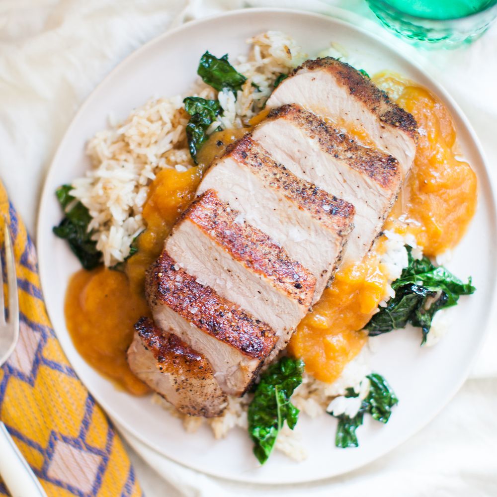 seared pork chop with salty apricots, rice and buttery kale