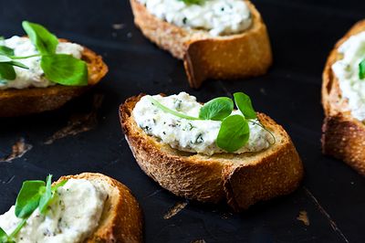Ramped Up Crostini with Ricotta and Pea Shoots