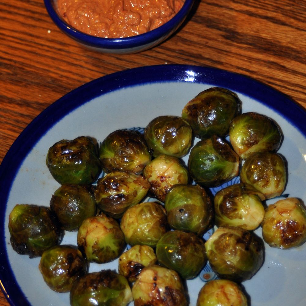 marinated grilled brussels sprouts with walnut-sage romesco sauce