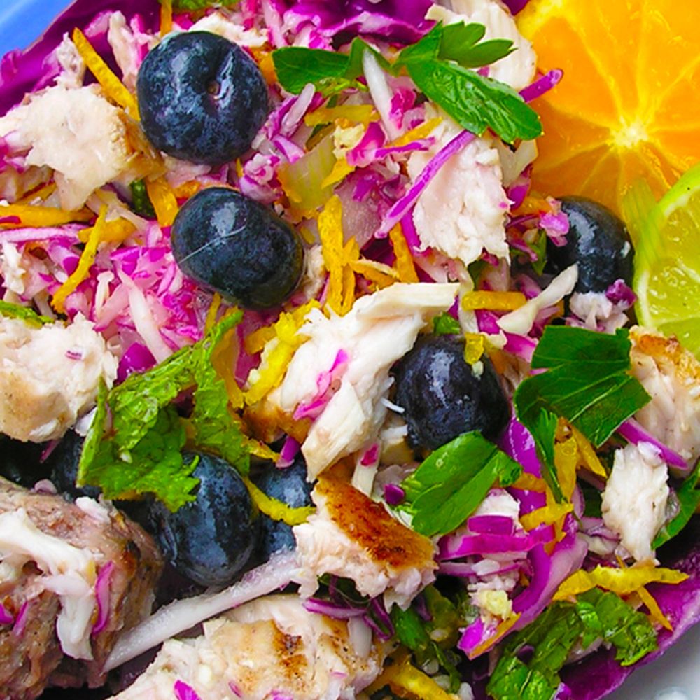 chicken or fish salad with toasted almonds, feta, blueberries, mint, and orange zest