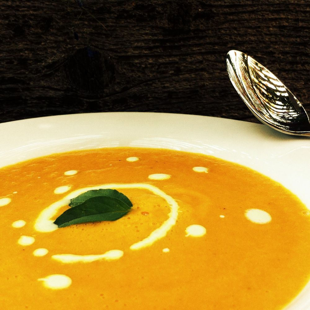 chilled curried carrot soup with herb yogurt sauce