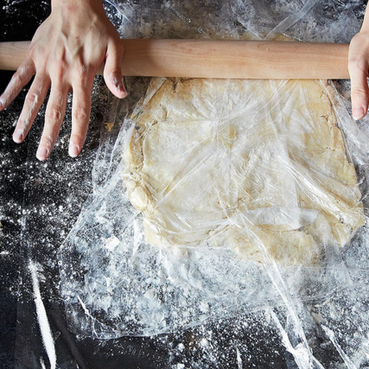 Wrap the Dough in Plastic and. Roll out the Dough. Women fermented Dough.