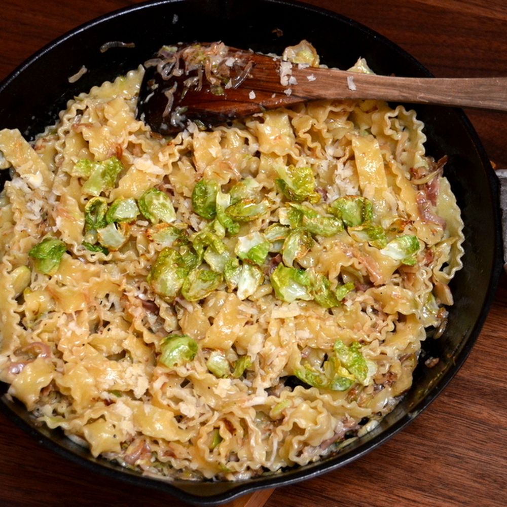 pasta with caramelized shallots and brussels sprouts and speck