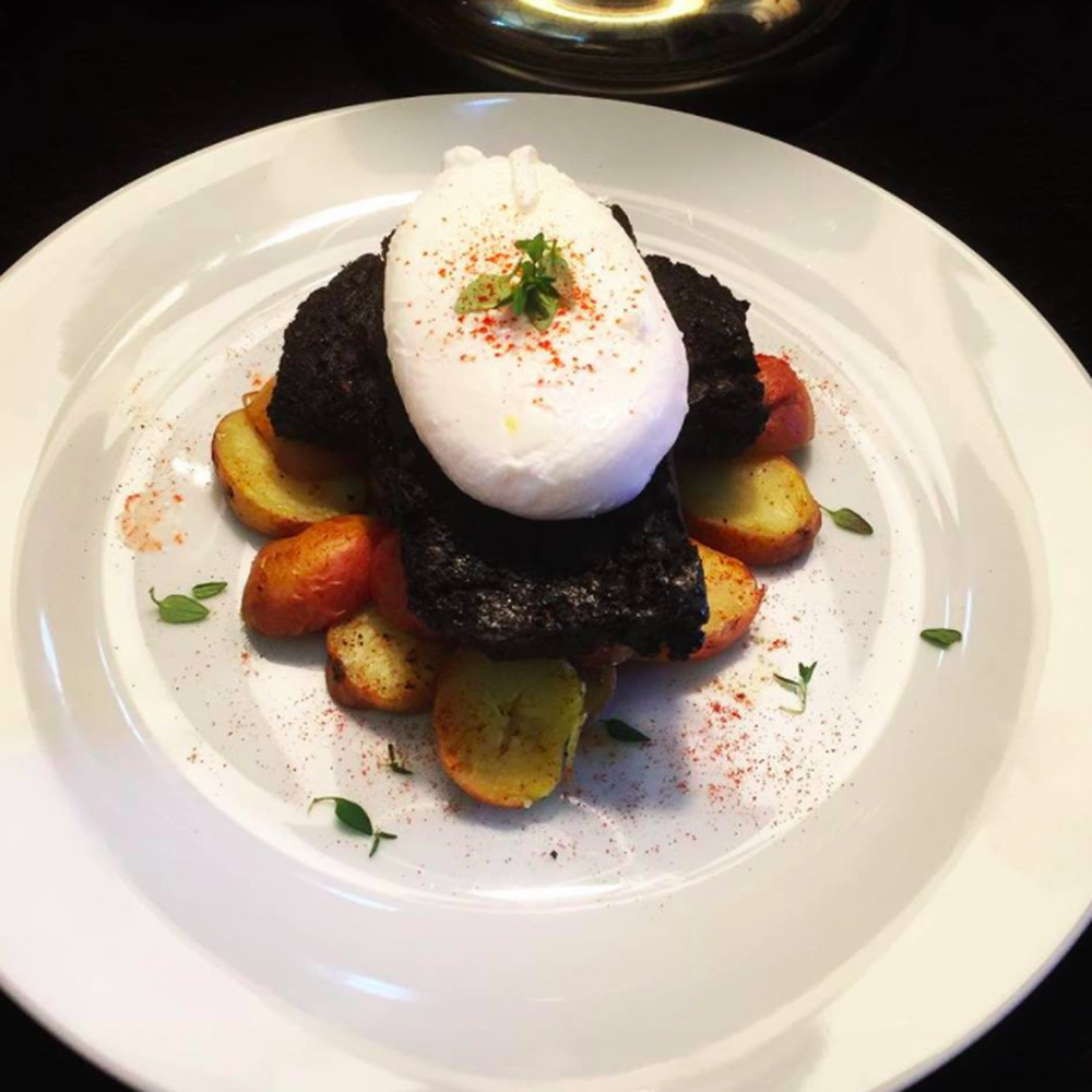 Poached eggs with seared boudin noir & over roasted baby potatoes.