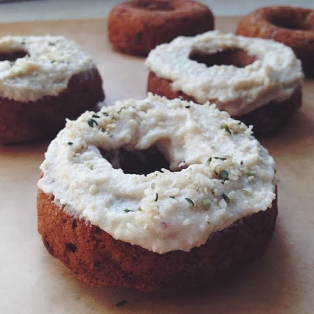Vegan baked banana-bourbon donuts with cashew cream cheese frosting.