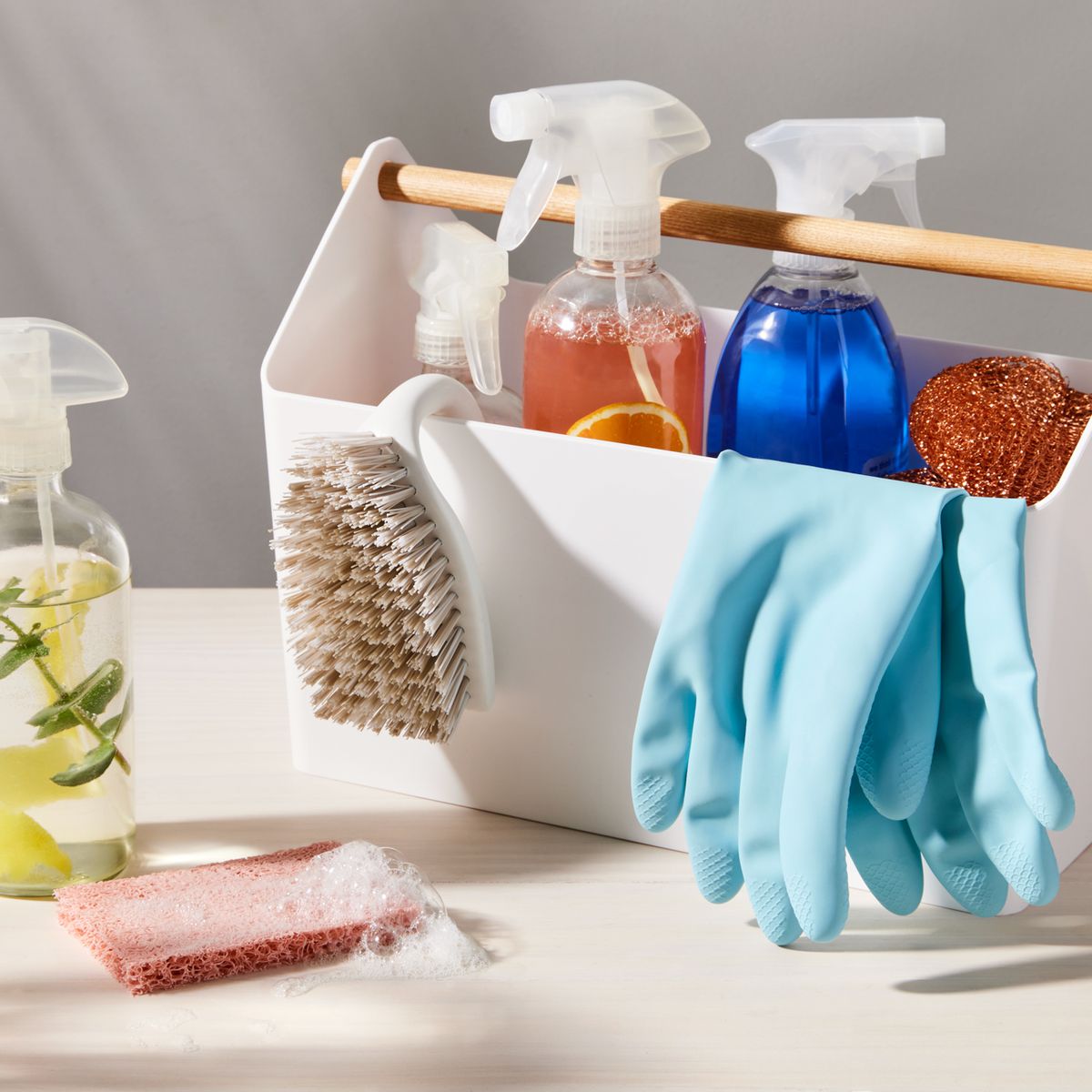 Different cleaning supplies and tools on window sill indoors Stock