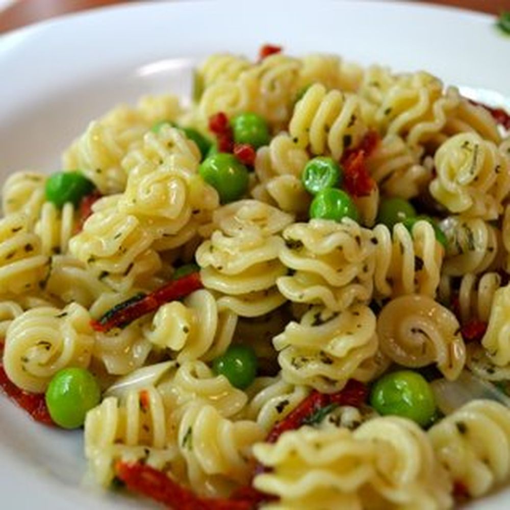 Radiatore pasta with ramps, sundried tomatoes and peas