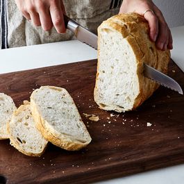 cutting bread by Patricia Berkowitz