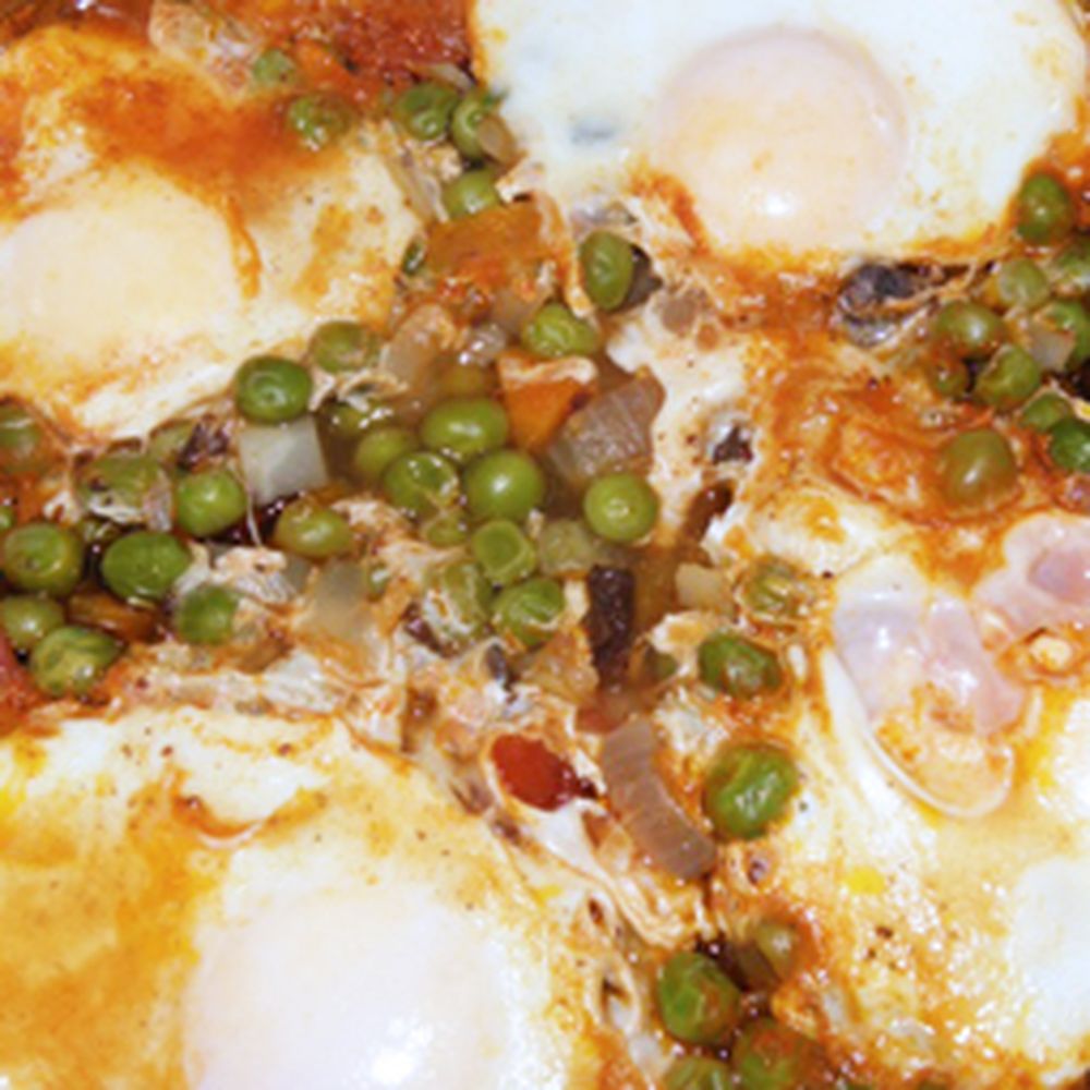 stewed sweet peas with eggs and chourico with fresh coriander