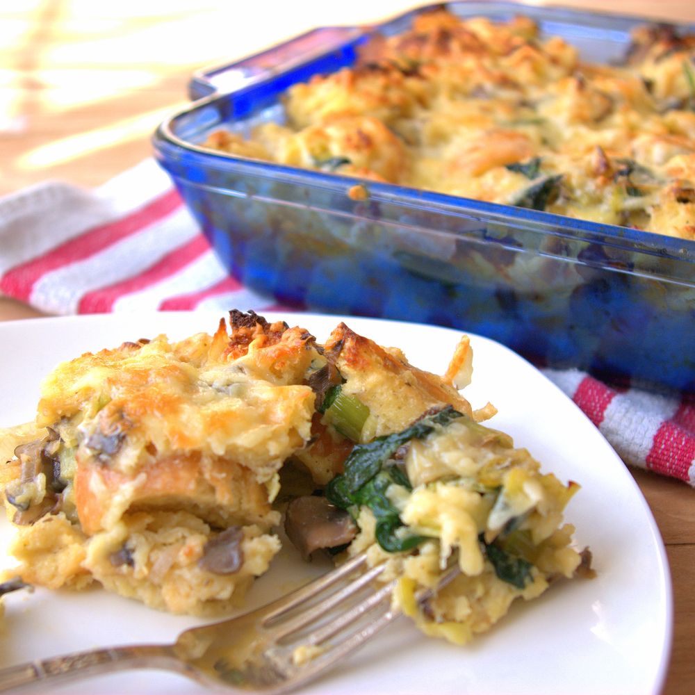 Savory bread pudding with spinach, leeks, and mushrooms