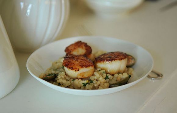 Israeli Couscous with Roasted Lemons & Capers topped with Seared Scallops