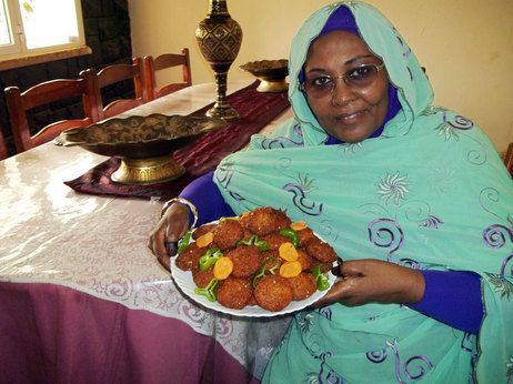 The reporter's mother, Nawal Elbager, of Khartoum, Sudan, shows off her falafel.