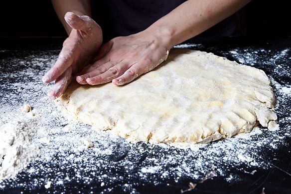 patting out biscuit dough