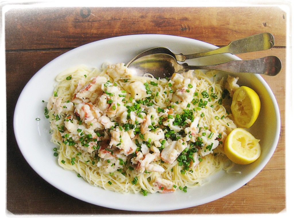 Smoky grilled lobster on capellini with lemon butter sauce, sprinkled with lots of fresh chives